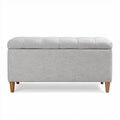 Banco tapizado en tela gris con patas de madera de 100 x 40 x 40cm